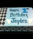 Plaid Print 1st Birthday Cake, Blue buttercream iced, sheet decorated with an edible plaid print and black dots.  Everything on this cake is EDIBLE. (Serves 24-98 party slices) 