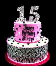 15th Damask Pearl Birthday cake,  White and pink buttercream iced, 2 round tiers decorated with black and white pearls, an edible black Damask wrap.. Everything on this cake is EDIBLE.  (Serves 28-55 party slices)