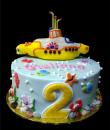 Yellow submarine 2nd Birthday Cake,  Blue buttercream iced,  round decorated with starfish, crabs, sea turtles, octopuses, sea horses, rocks, plants, dots, complete with a yellow submarine!  Everything on this cake is EDIBLE.   (Serves 8-80 party slices)