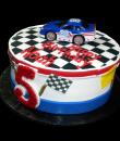 Race Car 5th Birthday Cake,  White buttercream iced,  round decorated with racing flags, checkered top, and #88 race car. Everything on this cake is EDIBLE.  (Plastic character figurine was provided by client). (Serves 8-80 party slices)