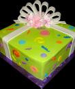 Modern Present Birthday Cake. Green buttercream iced, square decorated with circles, swirls, dots, flowers, ribbon and bow. Everything on this cake is edible. (Serves 12-90 party slices.) 