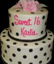 Black and white Polka Dot 16th Birthday cake,   Black Polka dots on White Buttercream iced 2  tiered . (Serves )