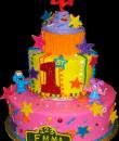 Sesame Street 1st Birthday Cake,  Buttercream iced, 2 round tiers decorated with stars, swirls, elmo, cookie monster, dots, sprinkles and a cupcake shaped top. Everything on this cake is EDIBLE.  (Plastic character figurine was provided by client). (Serves 28-55 party slices)