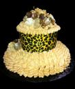 Leopard Flower Birthday cake,  Champagne buttercream iced, round decorated with gilded flowers and an edible leopard print wrap set atop a bed of buttercream ruffles. Everything on this cake is EDIBLE. 